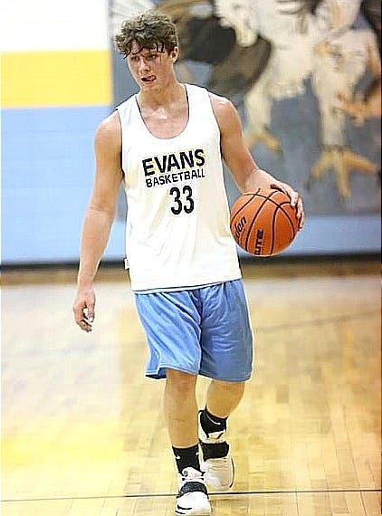 Evans' Wyatt Austin, seen here from a scrimmage earlier this season, scored a team-high 22 points in leading the Eagles to their first win of the season Tuesday night, an 81-55 victory over Johnson Bayou.