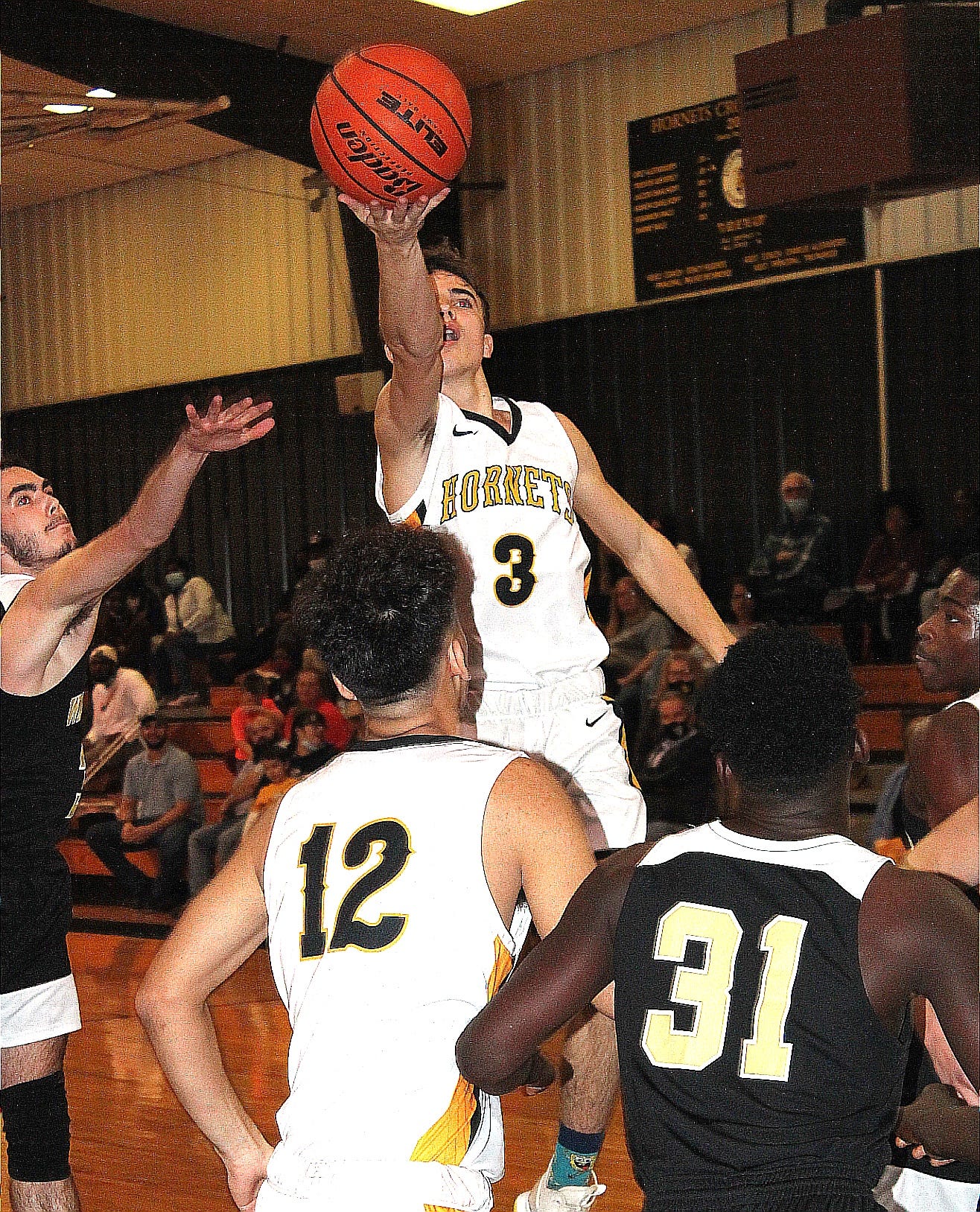 Hornbeck's Jaren Mitcham (3) rises up to score two of his 14 points in the Hornets' victory over Leesville, 45-36.