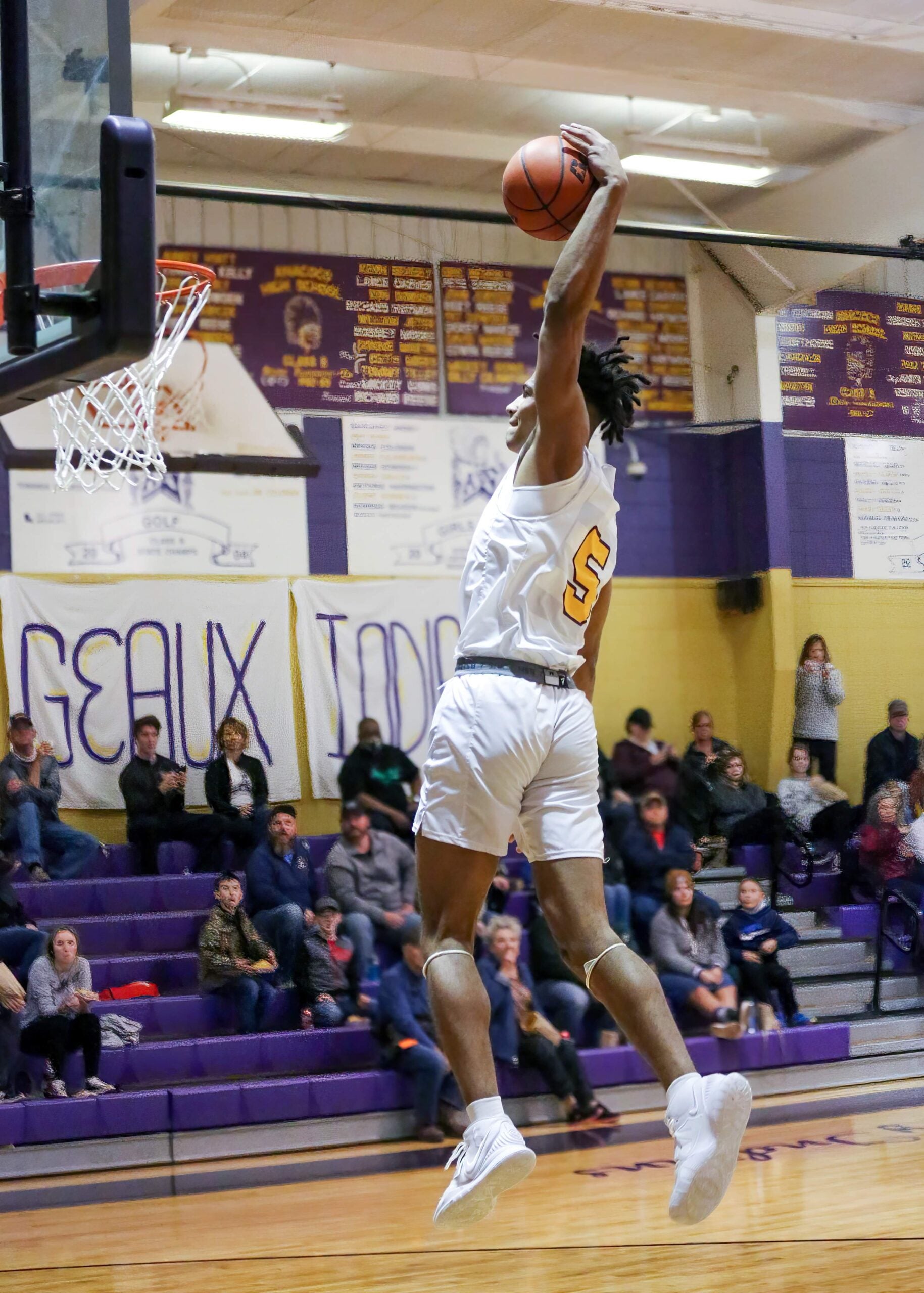 Anacoco senior Shaun Riley soars in for the dunk during the Indians' win over Negreet on Saturday.