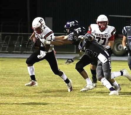 The Rosepine duo of Caden Stephens (24) and Jake Smith (2) prevented Pickering's Evan Fernandez from getting the corner during the Eagles' win last week over the Red Devils. Rosepine faces Logansport on Friday night for homecoming.