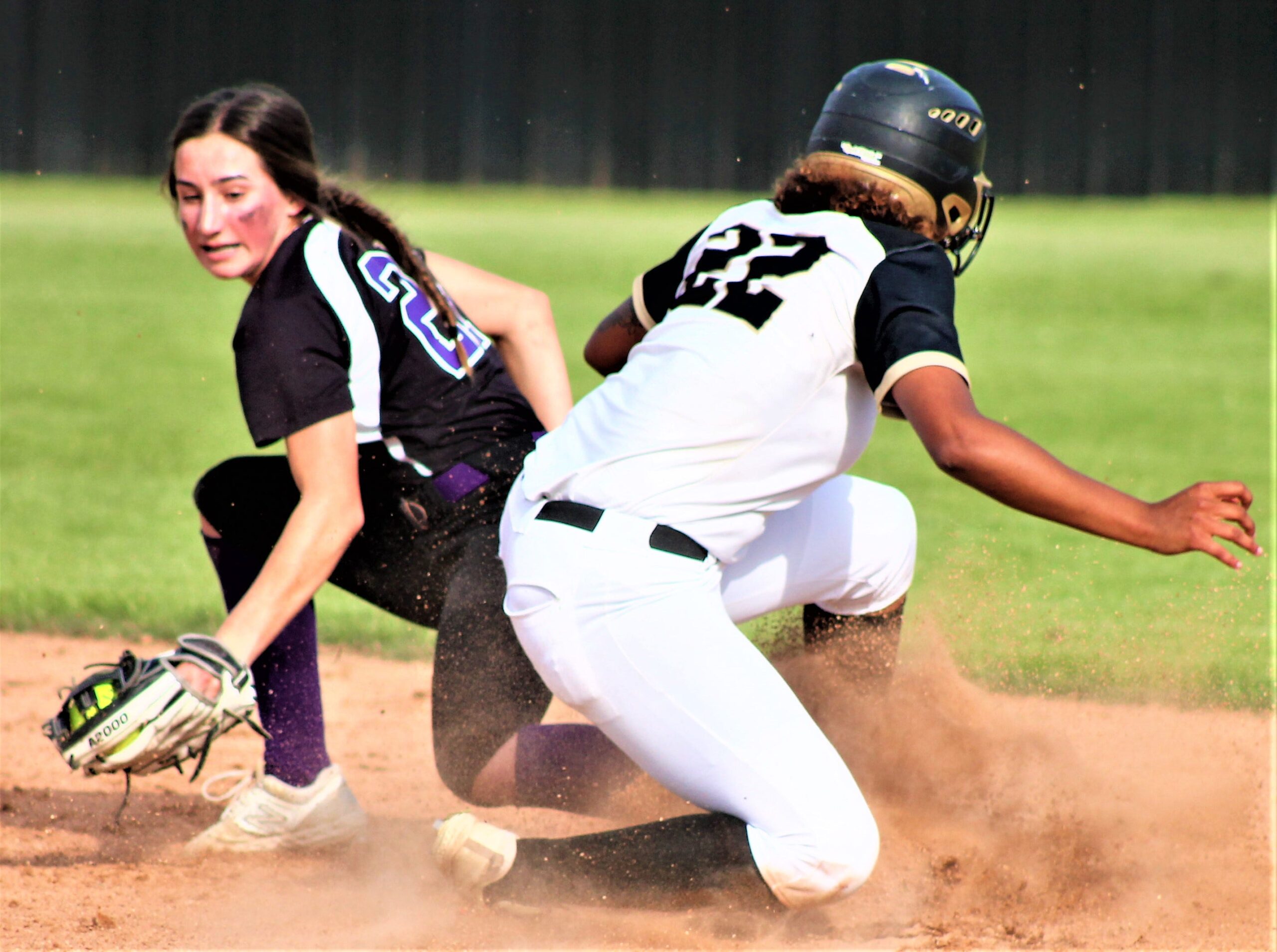 Leesville junior Amaya Thomas (22) slides safely into second base during the Lady Cats' first-round playoff win a few weeks ago. Thomas was one of three Lady Cats named first-team all-district in 3-4A.