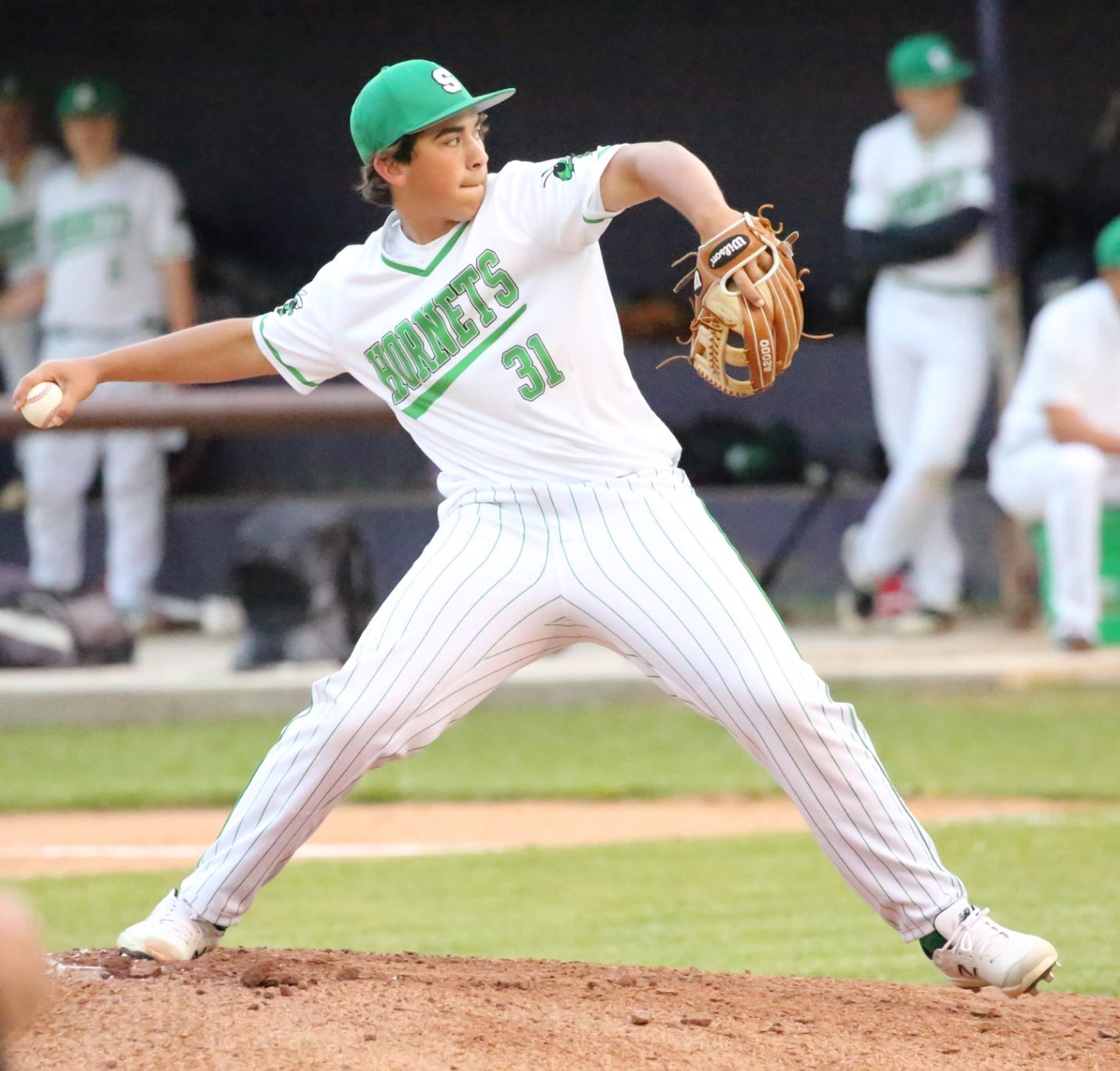 Singer's Caston Perkins fires a pitch during the Hornets' loss to Anacoco on Tuesday.