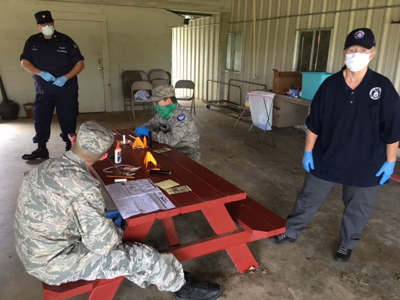 Rocket Build, Major Plummer and 2nd Lt Rebecca Evans supervising C/TSgt Jimmie Evans IV and C/A1C Sam Welch.