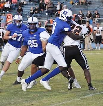 DeRidder defender Bryant Hammond (9) wraps up a ball carrier during a recent Dragon outing. Hammond and the rest of the defense limited Marksville to only one score in a 9-7 DeRidder win.