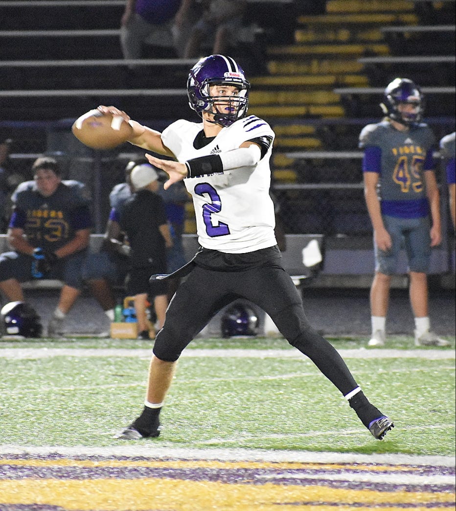 Rosepine junior Jake Smith (2) fires a pass downfield in the Eagles' loss to the Logansport Tigers on Friday. He threw for 157 yards in his first career start.