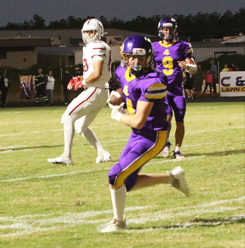 South Beauregard's Bryce Deason heads up the field after feeling in a pass during the Golden Knights' loss to Dunham on Friday, 49-0.
